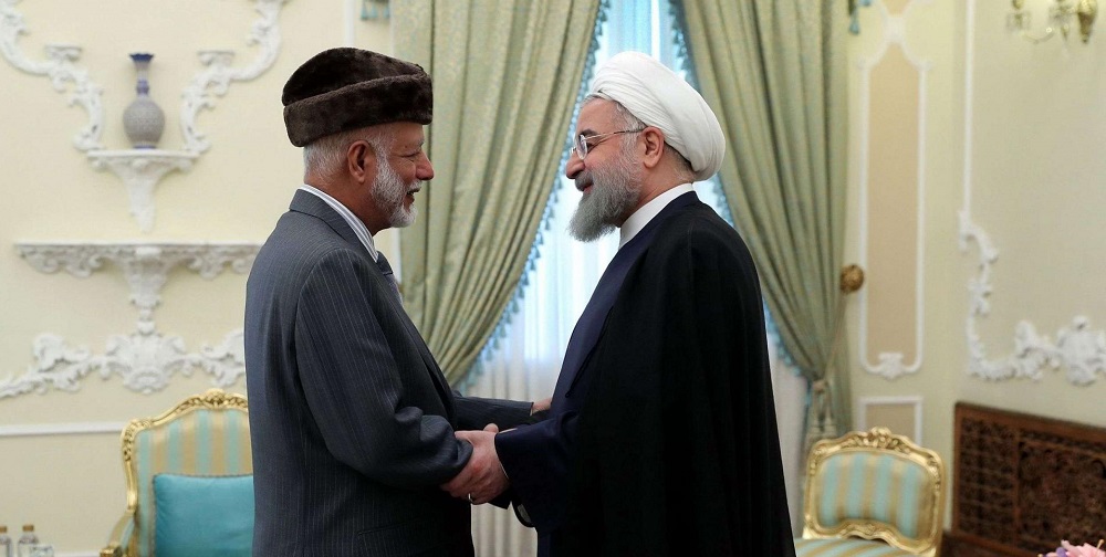 وزير الخارجية العماني يوسف بن علوي والرئيس الإيراني حسن روحاني